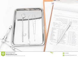 Dental Tools Equipment And Dental Chart On White Background
