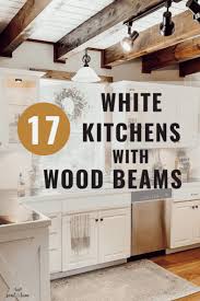 white kitchens with wood beams