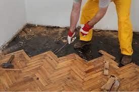 remove stubborn glued wood flooring