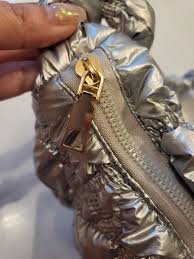 puffy mettalic silver bag women s