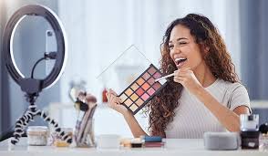 hispanic woman records makeup tutorial