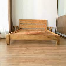 wooden bed frame made of solid teak