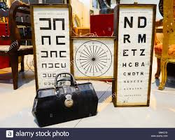 Opticians Vintage Eye Chart Poster And Doctors Suitcase At