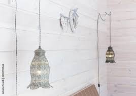Vintage Lamps Hanging On A White Wooden