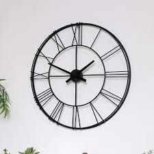 large black metal skeleton wall clock