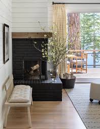 Corner Black Brick Clad Fireplace With