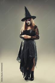 gothic young woman in witch halloween