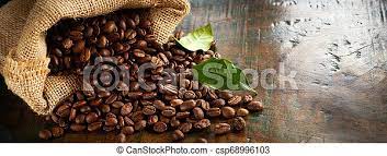Of the two types of roasted coffee beans, the best type that is favored worldwide is considered to be arabica coffee beans, even though the most expensive type is the robusta coffee beans. Panorama Banner Of Fresh Roasted Coffee Beans Blended To Provide The Perfect Flavor Spilling From A Hessian Bag Onto An Old Canstock