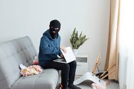 Indoor Shot Of Male Burglar Wearing