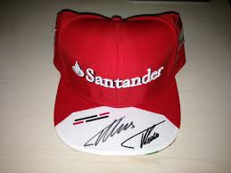 A six panelled fernando alonso ferrari hat with large ferrari shield embroidery on front, fernando alonso embroidered on left side. Ferrari Alonso Signature Cap