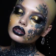 black makeup and gold glitter