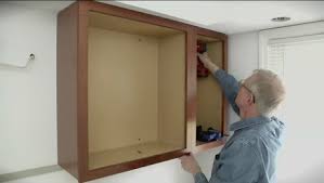 installing upper kitchen cabinets