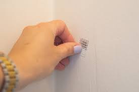 how to fill nail holes in drywall the