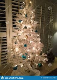 A White Artificial Christmas Tree With Ornaments Stock Photo
