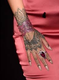 Celebrities get tattooed all the time it seems, but not many forgo a tattoo machine. A Guide To Rihanna S Tattoos Her 25 Inkings And What They Mean Capital Xtra