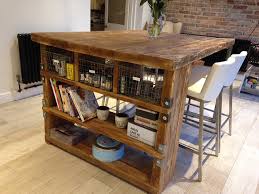 This kitchen island features a butcher block and seating on each end of the island. Industrial Mill Style Reclaimed Wood Kitchen Island Industrial Kuche Cheshire Von Reclaimed Bespoke Houzz