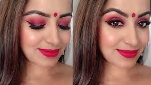 face makeup with red saree