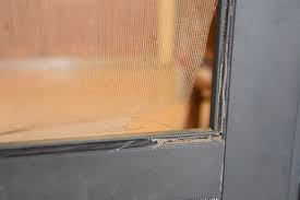 repair a window screen in a metal frame