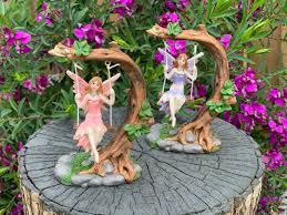 fairy on tree swing garden décor