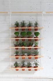 Thought this plant stand was made of wood? 35 Diy Plant Stands To Organize The Jungle In Your Home