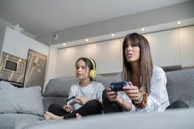 mother and daughter playing video games