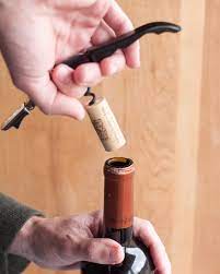 A handy video has shown how you can remove the cork remove the foil from the top of the cork, then sit on a chair with the bottle of wine between your legs. How To Open A Bottle Of Wine Using A Wine Key Corkscrew Kitchn