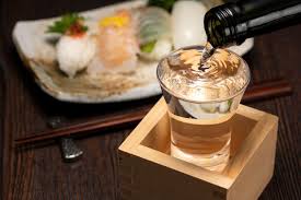drink sake from a square wooden m cup