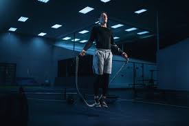 active man on training workout with rope