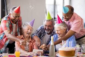 Find out all of their favorite music that they listened to when they were younger and play it at the party. Cheerful Senior People Pointing At Smart Phone During Birthday Stock Photo Picture And Royalty Free Image Image 82720517