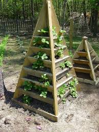 In the end i just created a strawberry planter from materials that are easy to get and work with and do not require too much labor. How To Build A Pyramid Strawberry Planter Strawberry Planters Diy Strawberry Tower Pyramid Planter