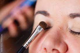 makeup artist apply make up stock photo