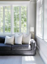 dark gray couch with white pillows