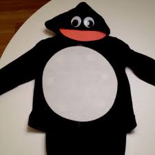 This costume takes no time at all and packs quite the cute punch. Cheap And Easy Penguin Costume Black Pants Orange Socks And Black Converse Not Pictured Penguin Costume Halloween Kids Diy Costumes Kids