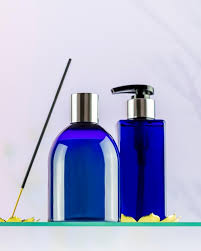 Blue Cosmetic Bottles On Glass Shelf