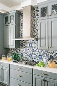 Tile decals such as gypsy yaya did above. The Stunning Hand Painted Backsplash Tile Inspired Interior Designer Tiffany Brooks On All Kitchen Backsplash Designs Trendy Kitchen Backsplash Kitchen Remodel