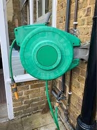 Comparing An Automatic Garden Hose Reel