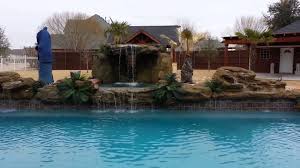 The waterfall pours off the top of the rocks, and down into the pool. Grotto Waterfall Backyard Waterfall Products Universal Rocks