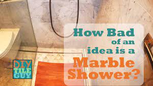 marble shower floor showing dark spots