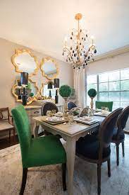 Quality black dining table with green chairs. Amanda Carol Interiors Emerald Green Gold Mirrors Weathered Wood Dining Table Restoration Hardware St Green Dining Room Gold Dining Room Green Dining Chairs