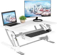 A standing desk converter is a product that is placed on top of, or attached to, a desk or table that allows you to stand while working. Amazon Com Vivo White Height Adjustable 36 Inch Stand Up Desk Converter Quick Sit To Stand Tabletop Dual Monitor Riser Workstation Desk V000vw Office Products