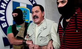 Golden Dawn&#39;s <b>Christos Pappas</b> is escorted by masked officers to the <b>...</b> - Christos-Pappas-010