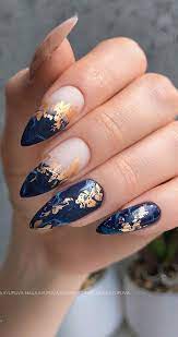 gold foil on dark blue nails