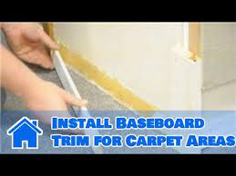 install baseboard trim for carpet areas