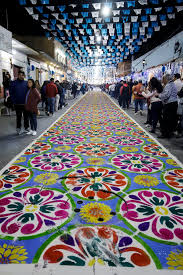 giant sawdust carpets line streets of