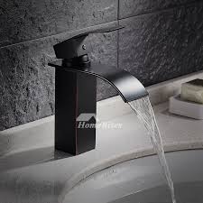 Tempered glass disk for cascading effect enhancing the beauty of flowing a faucet that catches the eye and engages the senses: Designer Oil Rubbed Bronze Industrial Bathroom Faucet Waterfall Black