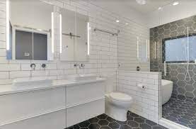 A background of vibrant yellow tiles framed by cream subway tiles is a guaranteed way to make a sunny statement in the bathroom. Hexagon And Subway Tile Bathroom Minimalistisch Badezimmer Portland Von Let S Remodel