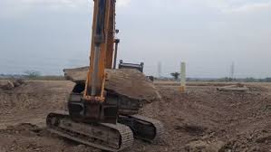 Excavator Is Lifting Big Clay Stone