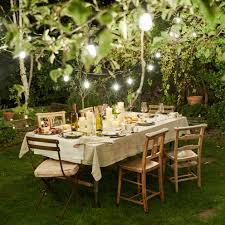 outdoor dinners with string lights
