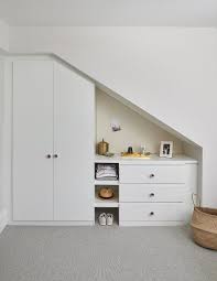 walk in closet with linen pin board and
