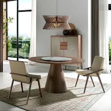 The metropolitan furniture line has contemporary dining sets that are sleek and lustrous with wood veneers over hard wood. Contemporary Dining Table 1016 Angel Cerda Porcelain Stoneware Walnut Base Round